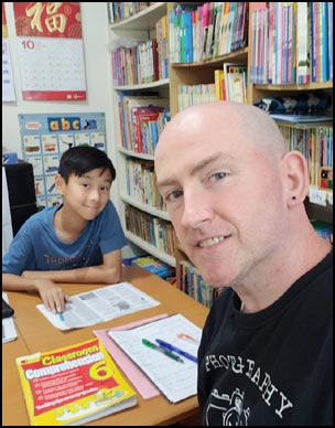 An English writing lesson with a Form 3 student.
