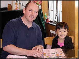 Story writing with a Primary 5 student in my teaching room.