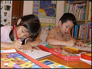 Primary 2 children working hard on their phonics worksheet